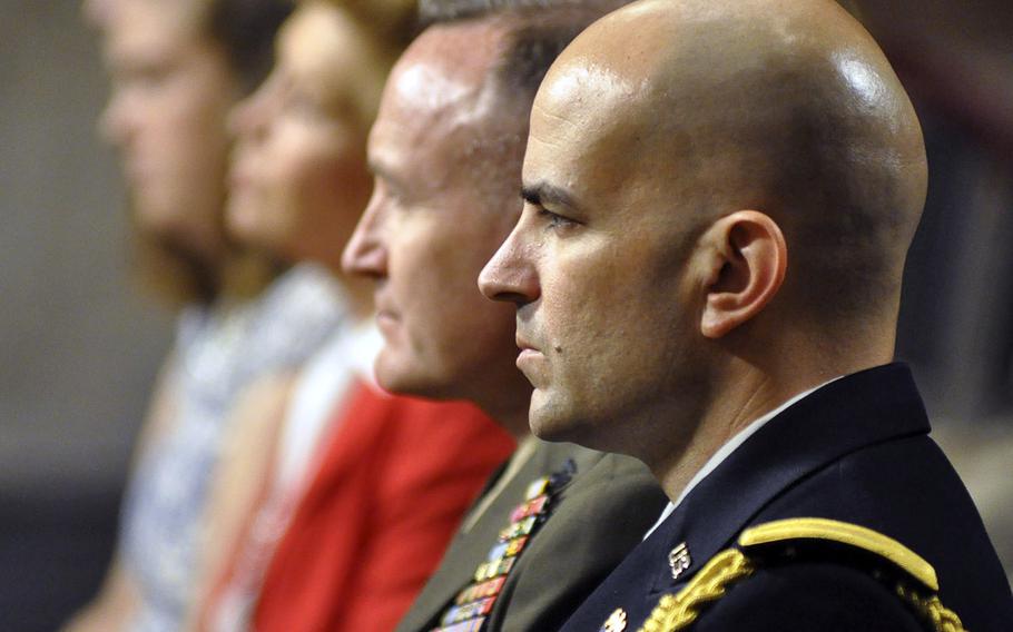 Spectators at a U.S. Senate hearing on Capitol Hill in Washington listen to testimony from Marine Corps Gen. Joseph F. Dunford, Jr., on Thursday, July 17, 2014. Members of the Committee on Armed Services were considering Dunford's nomination to be the next Commandant of the Marine Corps.