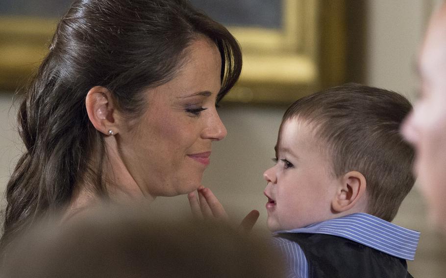 Former Army Staff Sgt. Ryan Pitts's wife Amy and son Lucas at the Medal of Honor ceremony at the White House, July 21, 2014.
