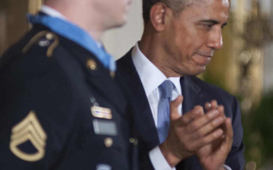 President Barack Obama leads the applause after awarding former Army Staff Sgt. Ryan Pitts the Medal of Honor at the White House, July 21, 2014.