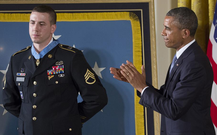 President Barack Obama leads the applause after awarding former Army Staff Sgt. Ryan Pitts the Medal of Honor at the White House, July 21, 2014.