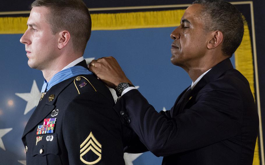 President Barack Obama awards former Army Staff Sgt. Ryan Pitts the Medal of Honor at the White House, July 21, 2014.
