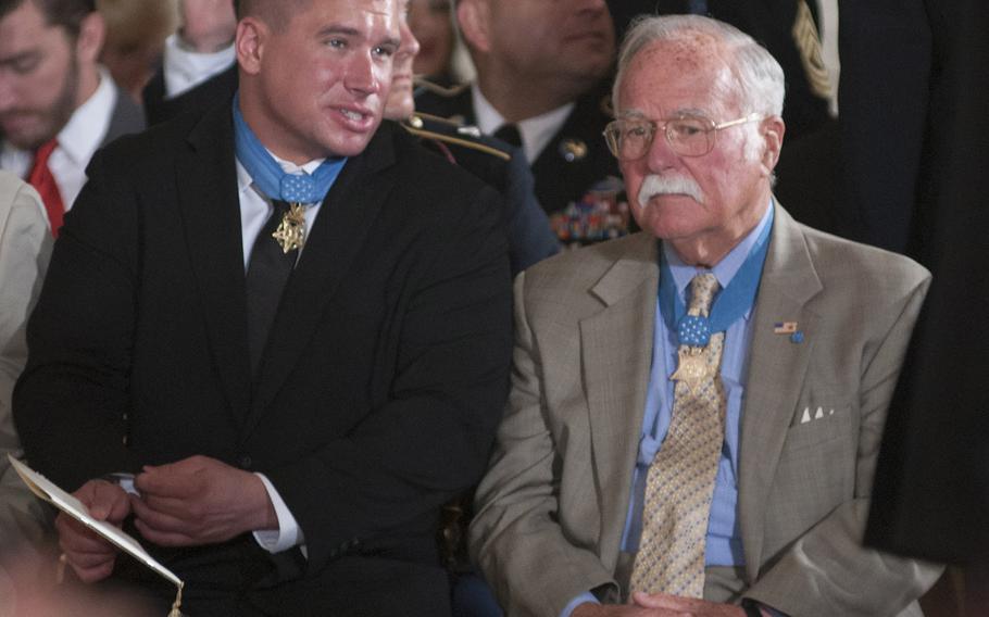 Medal of Honor recipients Kyle White and Harvey "Barney" Barnum await the start of the ceremony for former Army Staff Sgt. Ryan Pitts at the White House, July 21, 2014.
