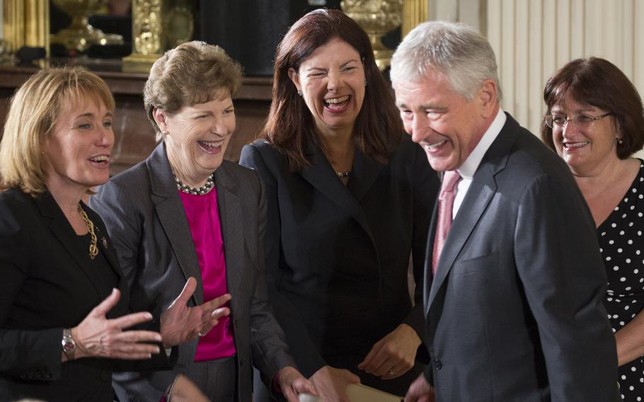 Secretary of Defense Chuck Hagel talks with New Hampshire political leaders, left to right, Gov. Maggie Hassan, Sen. Jean Shaheen, Sen. Kelly Ayotte and Rep. Ann McLane Kuster before the Medal of Honor ceremony for former Army Staff Sgt. Ryan Pitts, a Granite State native, at the White House, July 21, 2014.