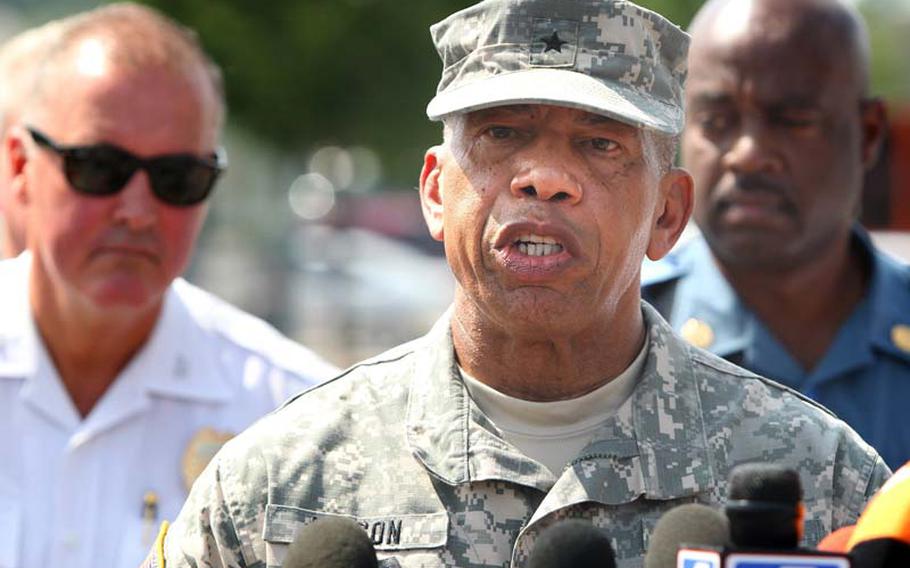 Brig. Gen. Greg Mason of the Missouri National Guard speaks to the media on Monday, August 18, 2014, to explain the capacity his soldiers will take in securing the Ferguson, Mo., protest area in the coming days. 