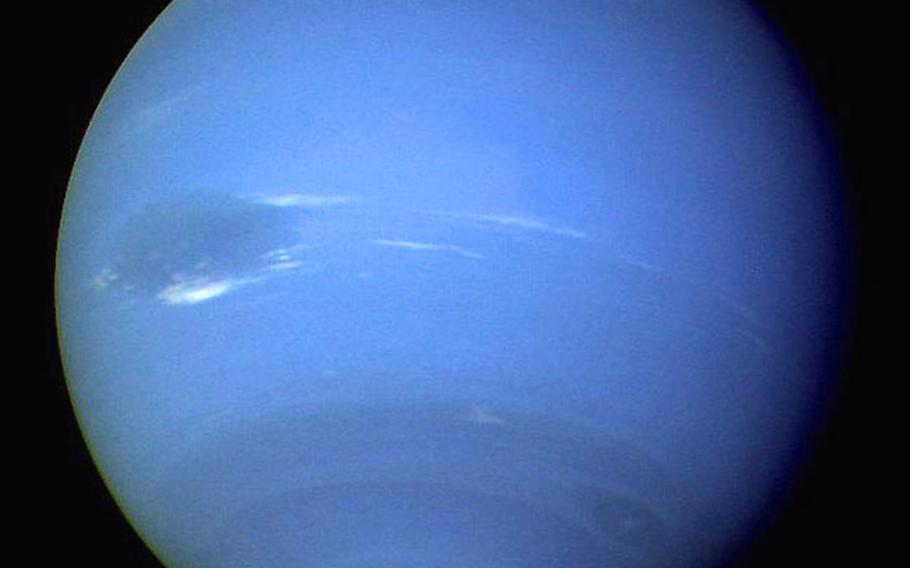 Voyager 2 took photographs of Neptune almost continuously during Aug. 16-17, 1989. It was discovered that the dark spot, seen in the middle left of the planet in this image, circled the planet every 16.1 hours. 