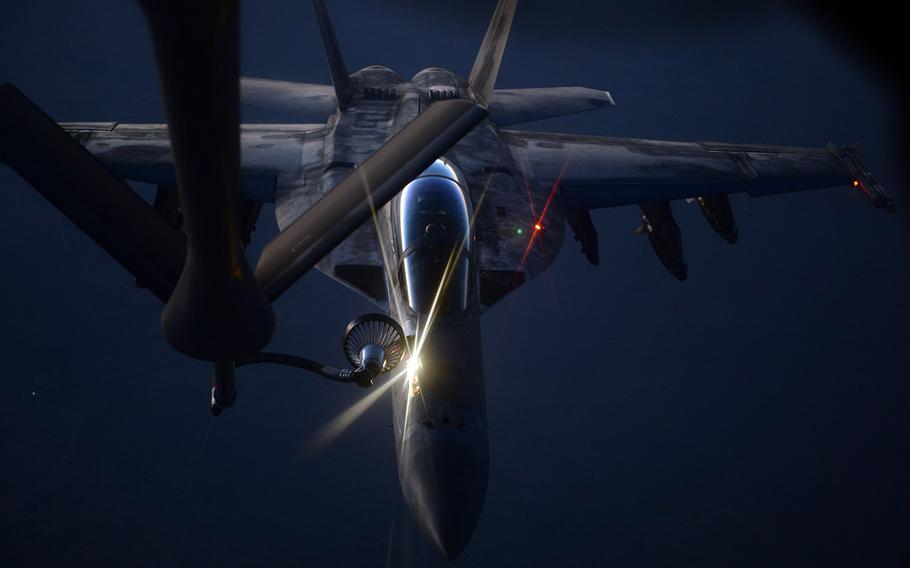 An U.S. fighter jet refuels from an Air Force KC-135 Stratotanker.