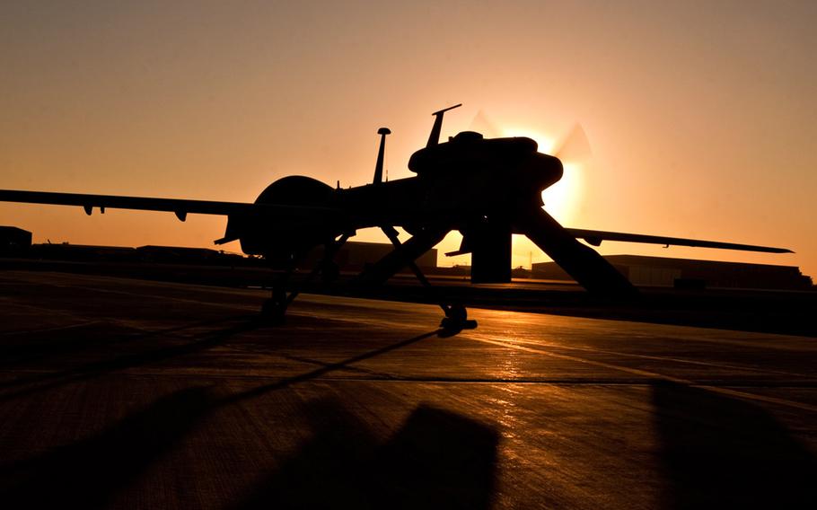 MQ-1C Gray Eagle, like the one that recently arrived at Fort Drum, N.Y., is silhouetted against the sun at Camp Taji, Iraq, in 2010.