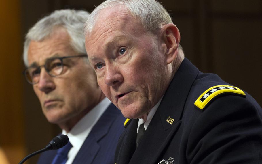 Secretary of Defense Chuck Hagel listens as Joint Chiefs of Staff Chairman Gen. Martin Dempsey testifies before the Senate Armed Services Committee, Sept. 16, 2014.