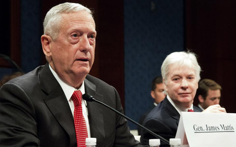 Retired Marine Corps Gen. James Mattis testifies at a hearing of the House Permanent Select Committee on Intelligence at the U.S. Capitol on September 18, 2014. Mattis told the committee that a blanket prohibition on ground combat was tying the military's hands. At right is former U.S. Ambassador to Iraq Ryan Crocker.