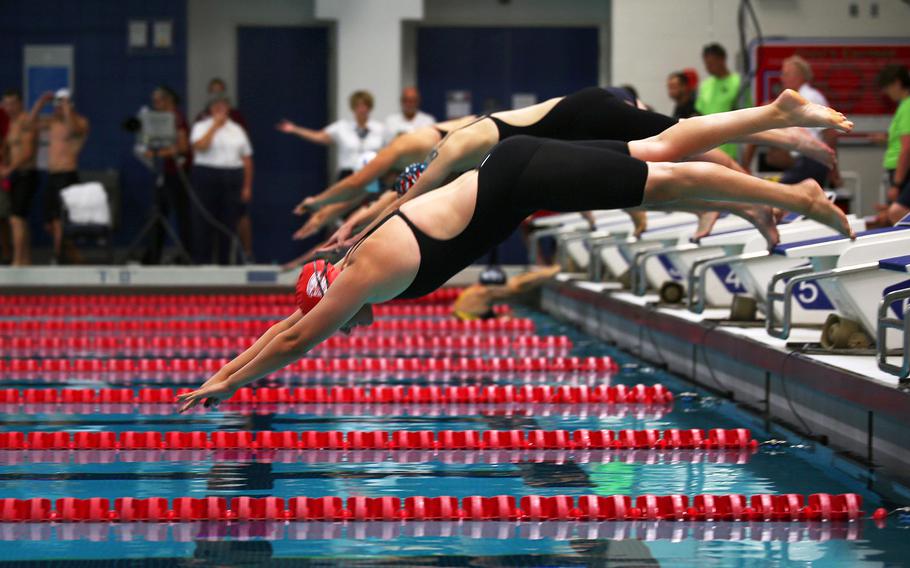 Staff Sgt. Maryann Miller from Clovis, Calif., dives first and finishes first for the 50-meter freestyle event at the 2014 Warrior Games on Sept. 30, 2014, at the United States Olympic Training Center in Colorado Springs, Colo.