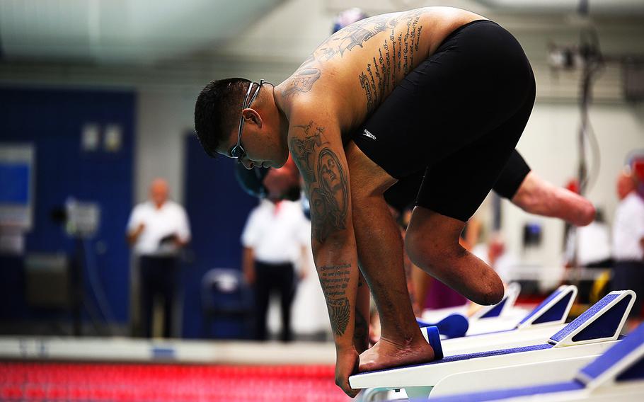 Sgt. Alex Nguyen from Fremont, Neb., prepares to take off for the 50-meter freestyle swim at the 2014 Warrior Games on Sept. 30, 2014, at the United States Olympic Training Center in Colorado Springs, Colo. 