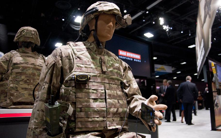 The Broadsword Soldier System suit by BAE Systems on display at AUSA 2014 in Washington, D.C. on Oct. 15. The suit is designed to eliminate the need for carrying batteries and other equipment by using a fabric that conducts electricity and transmits data without cords. Troops can recharge equipment by plugging into the suit. The Army and the Marine Corps both are evaluating the system, according to BAE.