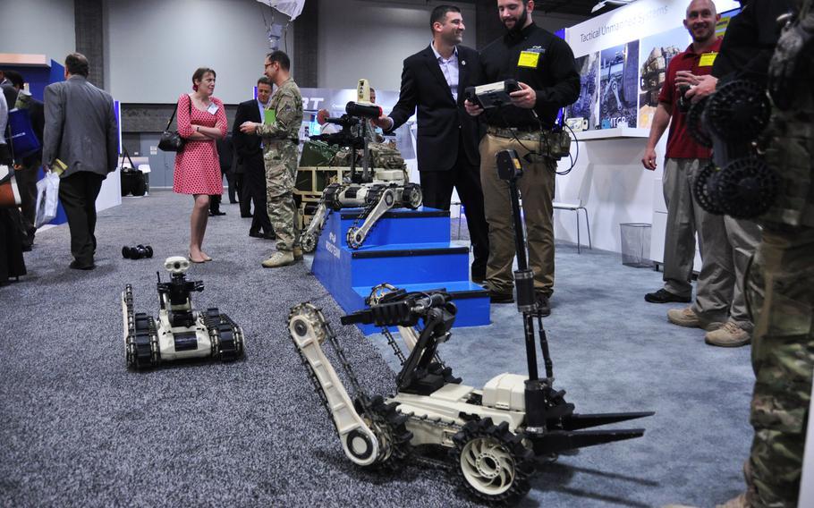 Attendees check out exhibitor booths at AUSA's annual expo in Washington, D.C. on Oct. 15, 2014.