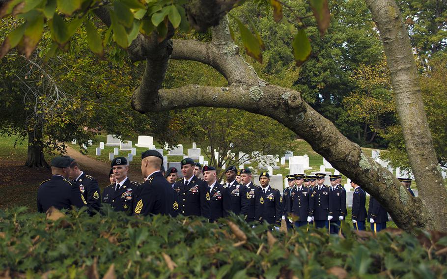 Green Berets wait for the start of the Wreath Laying Ceremony at JFK's grave site at Arlington National Cemetery on Oct. 21, 2014.