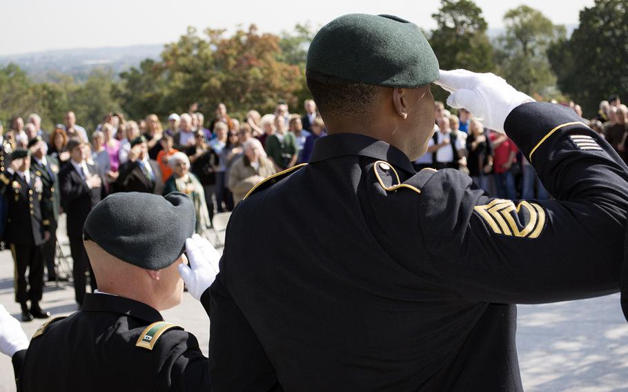 Green Berets salute during the Wreath Laying Ceremony at JFK's grave at Arlington National Cemetery on Oct. 21, 2014.