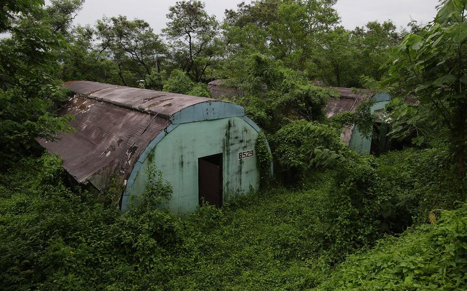 A row of concrete structures called "Quonset huts" lie inside the Subic Bay Freeport Zone, Zambales province, northern Philippines, on Oct. 18, 2014. The huts were used as barracks for U.S. Marines inside the former American naval base. It was closed in 1992 after the Philippine Senate voted not to extend the lease on the facility. Some of the abandoned huts were reused as dormitories and staff houses for employees. Other abandoned huts have not been touched since U.S. forces left 22 years ago.