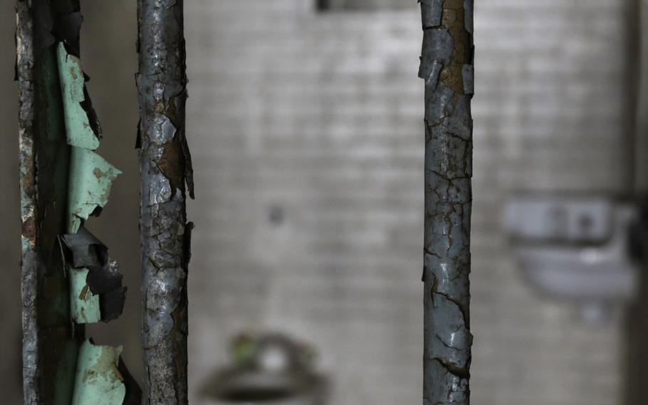 This Oct. 23, 2014, photo shows rusty and corroded bars on a cell at the abandoned Central State Farm prison in Sugar Land, Texas. The unit was closed down three years ago. 