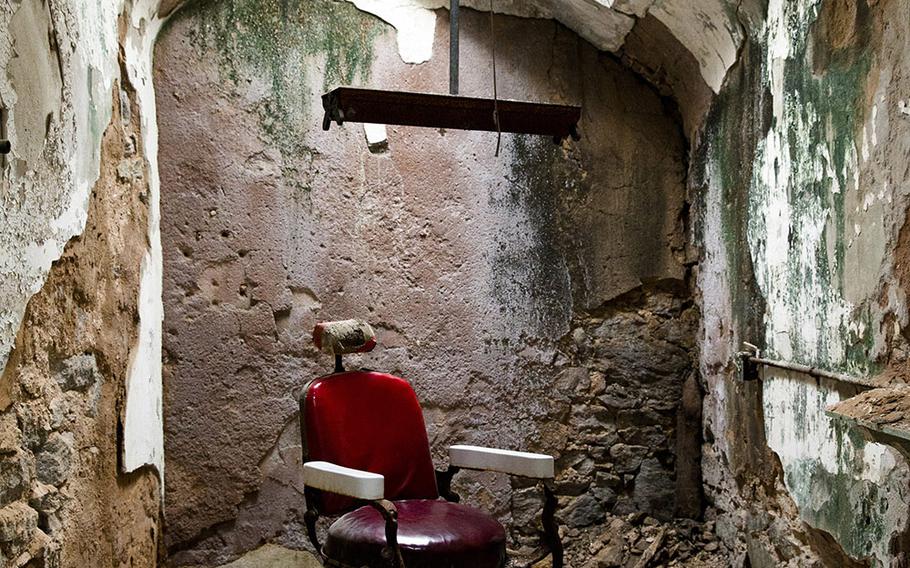 This Oct. 13, 2014, photo shows a barber shop in cellblock 10 at Eastern State Penitentiary in Philadelphia. The penitentiary took in its first inmate in 1829, closed in 1971 and reopened as a museum in 1994.