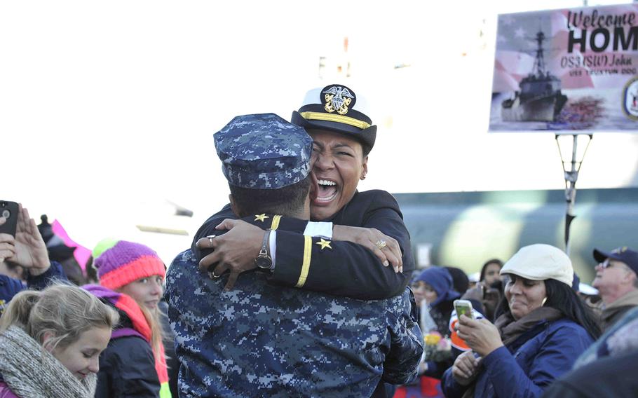 Ensign Bridget Mall hugs her brother, Seaman Brian Niles, on the pier after disembarking the guided-missile destroyer USS Truxtun on Nov. 15, 2014. The ship is returning to Naval Station Norfolk after a nine-month deployment in support of maritime security operations and theater security cooperation efforts in the U.S. 5th and 6th Fleet areas of responsibility.  
