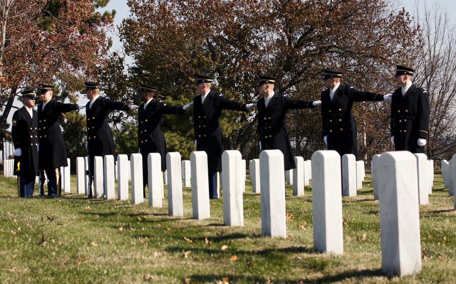 An honor guard firing party sets up before the burial ceremony for Army Pvt. Miguel A. Vera at Arlington National Cemetery on Nov. 20, 2014. Vera, who was killed in the Korean War, was one of 24 soldiers awarded the Medal of Honor in March after being previously overlooked because of their racial or ethnic backgrounds. Vera was originally buried in Puerto Rico.