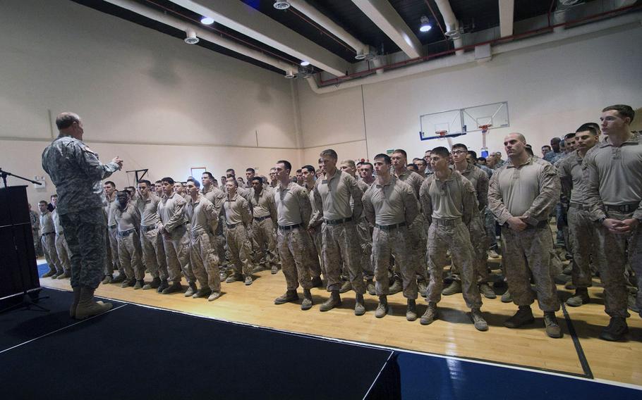 U.S. Chairman of the Joint Chiefs of Staff Army Gen. Martin E. Dempsey talks with approximately 150 U.S. military members during a town hall meeting in Baghdad on Nov. 15, 2014. 