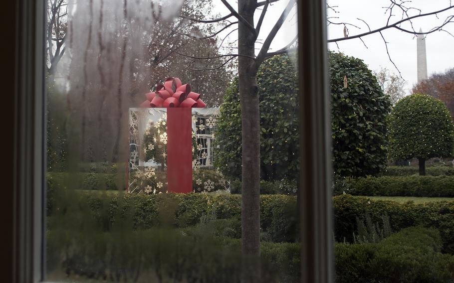 An oversized gift wrapped present sits in the Jacqueline Kennedy Garden at the White House on Dec. 3, 2014.