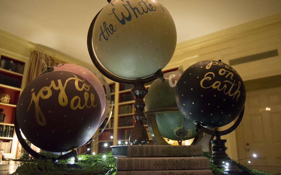Hand-painted globes sit on a table at the center of the library at the White House on Dec. 3, 2014.