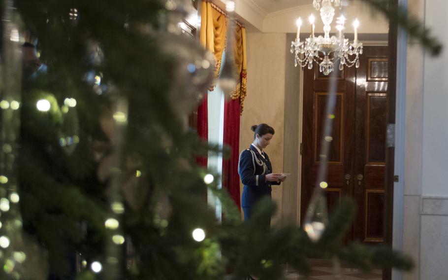 Maj. Stephanie Myers awaits guests during the press preview of the White House holiday decorations on Dec. 3, 2014.