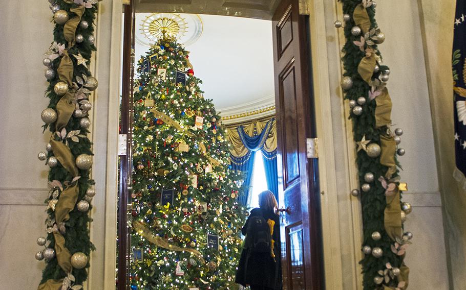 The official White House Christmas tree stands at 18 feet inside the Blue Room. The theme of the tree is "America the Brave" and pays tribute to servicemembers.