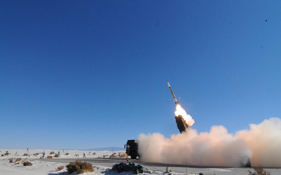 A missile is launched at an airborne target during a test of an air defense system at the Army's White Sands Missile Range, N.M., in November 2013.
