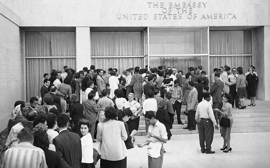 This Jan. 3, 1961 file photo shows Cubans lining up outside the U.S. Embassy in Havana, Cuba, in hopes of getting visas after President Fidel Castro ordered the embassy to reduce its staff within 48 hours.