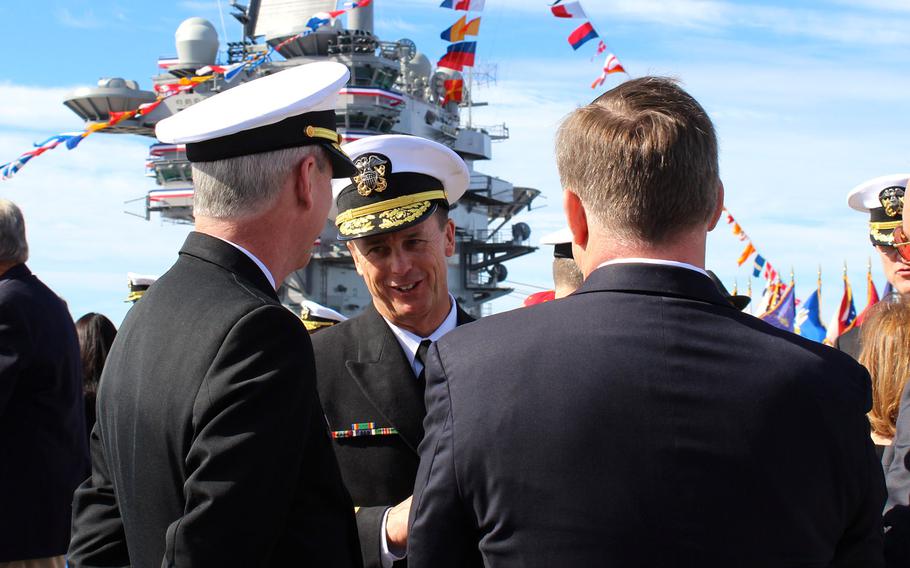 Vice Adm. Mike Shoemaker, who took command on Jan. 22, 2015 of Naval Air Forces and Naval Air Force Pacific, shakes hands with friends and fellow naval officers after his change of command ceremony, aboard the USS John C. Stennis at Naval Station North Island.