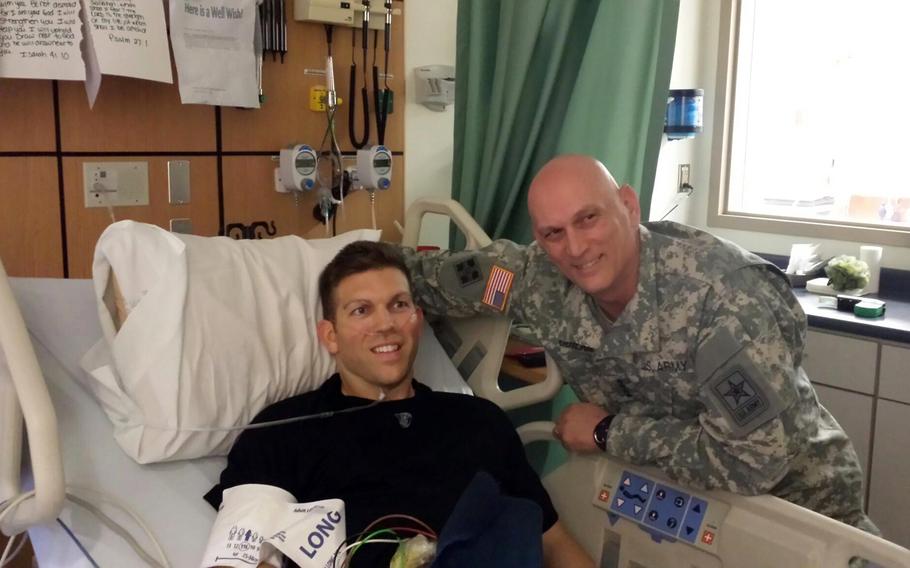 Army Chief of Staff Gen. Ray Odierno visits Maj. Patrick Miller in the hospital while Miller recovered from a gunshot wound during an attack at Fort Hood, Texas, in April 2, 2014.