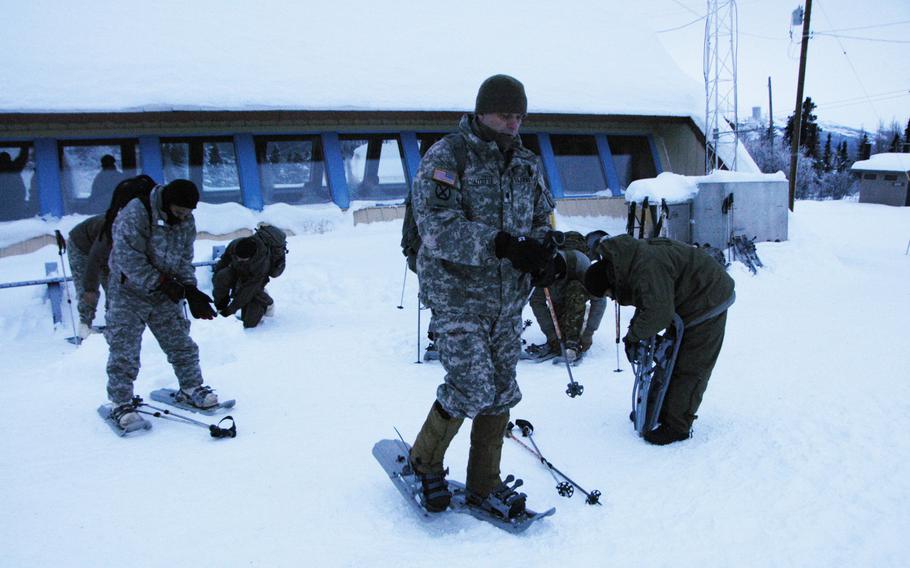 Soldiers prepare to march in snow shoes at Black Rapids Training Site, Alaska, on Feb. 10, 2015. 

