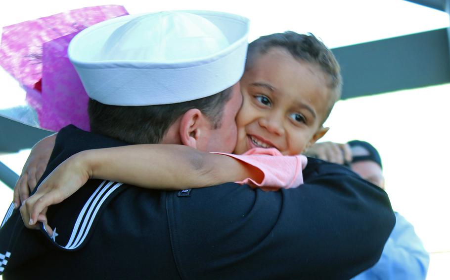 Petty Officer 2nd Class Matthew Granaas hugs his 3-year-old son, Bradley, on Feb. 25, 2015, after Granaas returned to Naval Base San Diego from a seven-month deployment aboard the USS Makin Island.