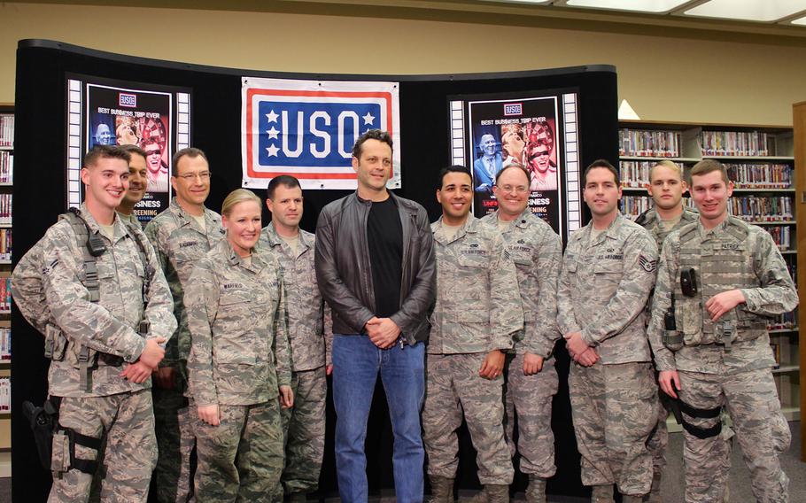 Actor Vince Vaughn poses for photos with airmen at Edwards Air Force Base, Calif., on Saturday. Vaughn met with about two dozen airmen and introduced an advance screening of his new movie, "Unfinished Business" as part of his third USO tour. 