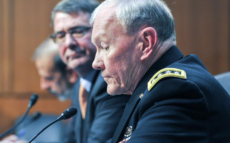 Army Gen. Martin Dempsey testifies before the Senate Armed Forces Committee on Tuesday, March 3, 2015. Looking on is Defense Secretary Ashton Carter.