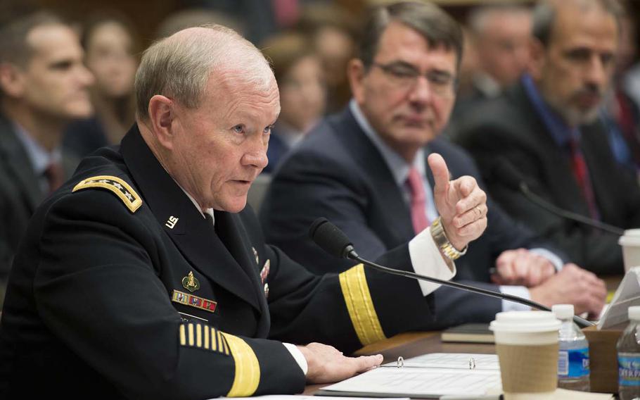 Army Gen. Martin E. Dempsey, chairman of the Joint Chiefs of Staff, testifies as Defense Secretary Ash Carter looks on before the House Armed Services Committee in Washington, D.C., March 18, 2015. The two defense leaders focused on defense programs and combating the Islamic State.