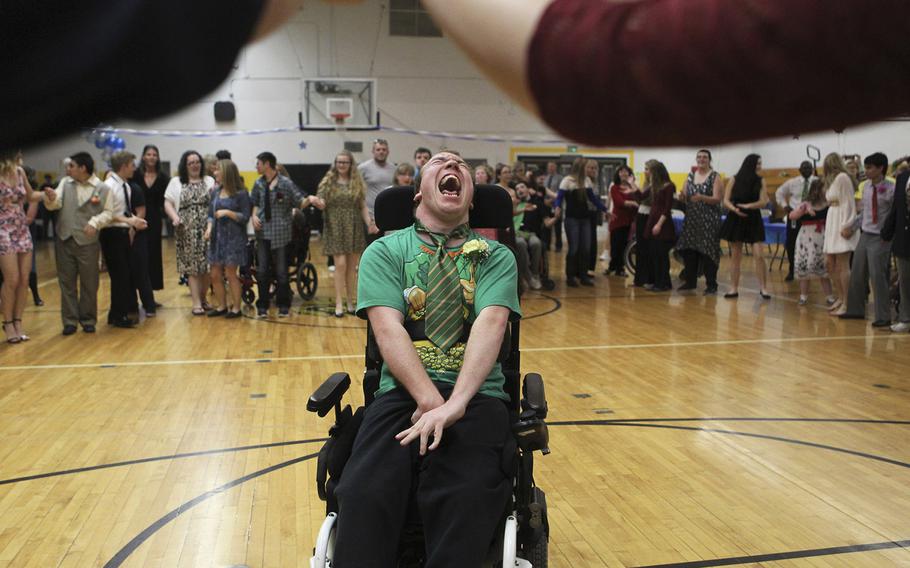 William Marlene, 21, moves across the dance floor on March 17, 2015, during the We Not Me Ball at Enterprise High School in Redding, Calif. Student leaders put on the prom for the special needs students at the school. 