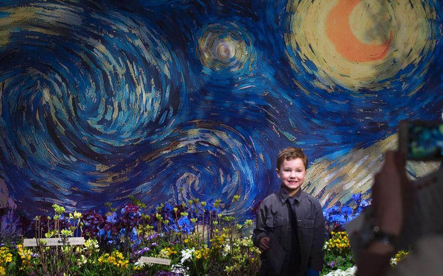 At the "Art in Bloom" themed Macy's flower show in downtown Minneapolis on March 22, 2015, Payne Serie,6,  had his picture taken in the impressionist garden inspired by Van Gogh . 