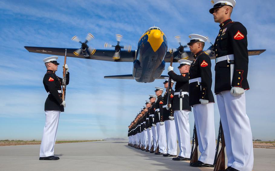 12TH PLACE | A U.S. Marine Corps C-130T Hercules aircraft with the Blue Angels, the Navy's flight demonstration squadron, flies over Marines with the Silent Drill Platoon at Marine Corps Air Station Yuma, Ariz., March 4, 2014.