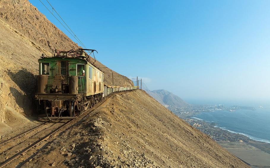 3RD PLACE | High above Tocopilla, Chile, one of SQMs Boxcabs coasts downhill to the Reverso switchback. Kabelleger / David Gubler (CC BY-SA 4.0) [<a href="http://commons.wikimedia.org/wiki/Commons:Picture_of_the_Year/2014/Results#/media/File:SQM_GE_289A_Boxcab_Carmelita_-_Reverso.jpg" target=_blank>Original image</a>]