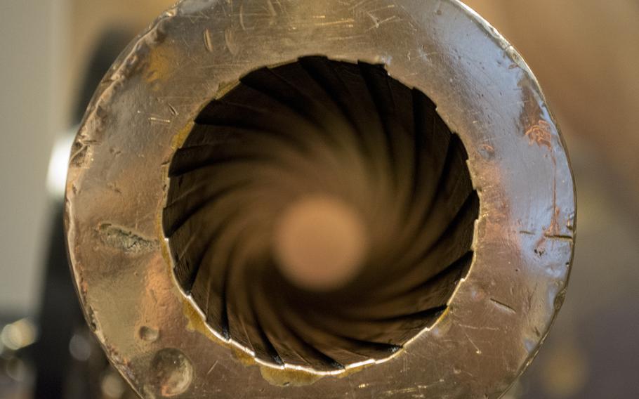 A look down the barrel of the 1874 experimental 3-inch rifled landing gun. The Ordnance Department at the Washington Navy Yard designed and manufactured this gun that was intended to support landing operations. While this shows experimental markings, it does not have a model or serial number. 