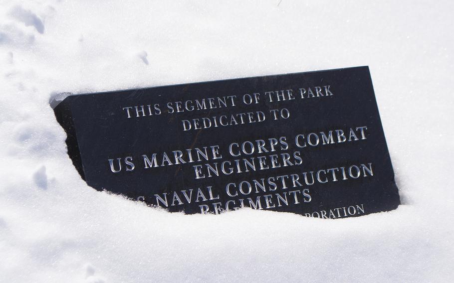 Outside the National Museum of the Marine Corps, in the Semper Fidelis Memorial Park, a sign is partially buried in snow on Feb. 19, 2015.