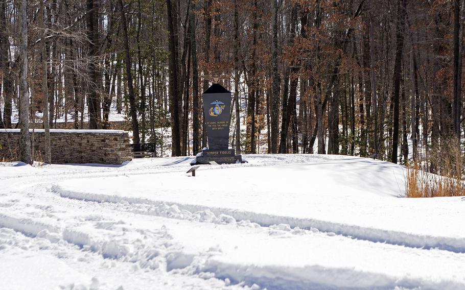 Outside the National Museum of the Marine Corps, in the Semper Fidelis Memorial Park, a statue is partially buried in snow on Feb. 19, 2015.