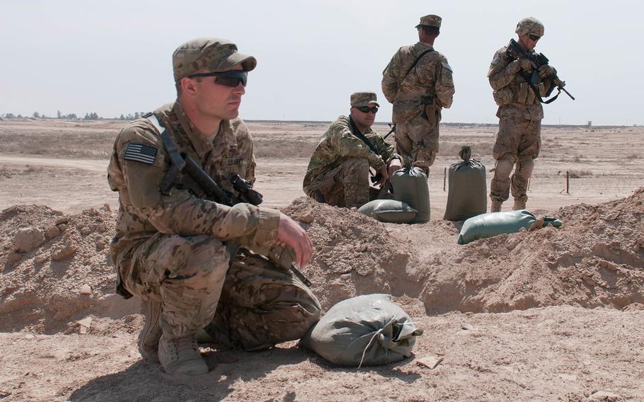 Soldiers with the 2nd Battalion, 505th Parachute Infantry Regiment, 3rd Brigade Combat Team, 82nd Airborne Division, observe soldiers from the Iraqi Army as they conduct a breach-and-assault training Besmaya Range Complex, Iraq, on March 26, 2015.