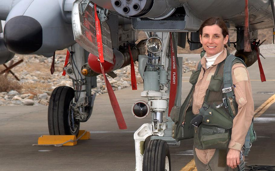 Lt. Col. Martha McSally stands with her A-10 Thunderbolt II aircraft. McSally was the first female pilot in the Air Force to fly in combat and to serve as a squadron commander of a combat aviation squadron.