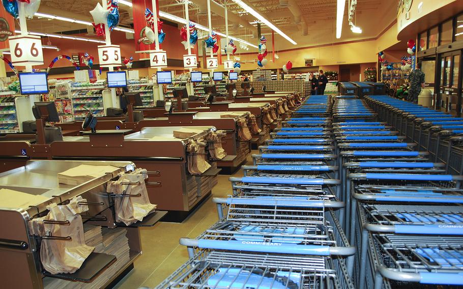 Empty shopping carts and checkout registers await commissary patrons hours before the grand opening of a new store at Naval Submarine Base New London, Conn., April 16, 2014.