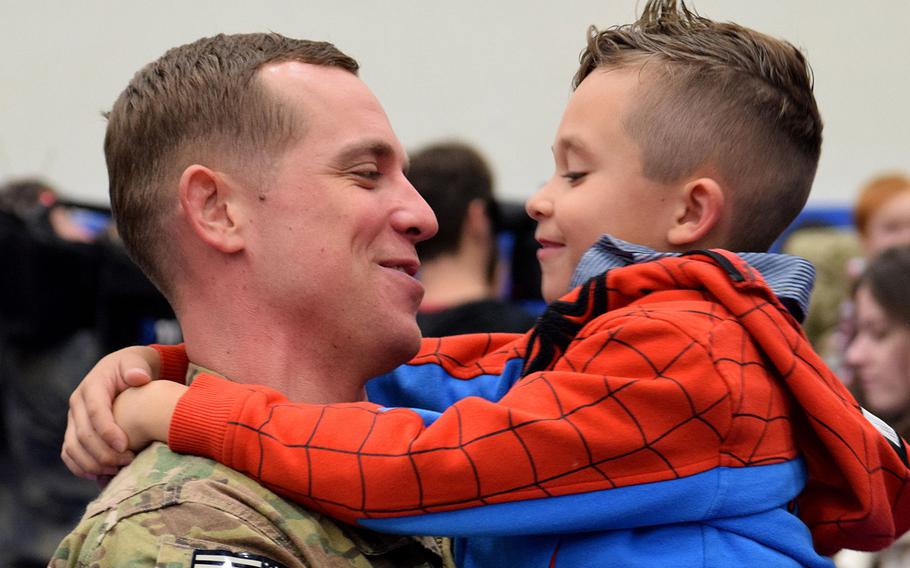Staff Sgt. Gilbert Cunningham reunites with his 6-year-old son, Paxtyn, at Joint Base Elmendorf-Richardson, Alaska, in November 2014 after he and fellow soldiers from the 23rd Sapper Company and 17th Combat Sustainment Support Battalion returned from Afghanistan. Two companies of the 2nd Engineer Brigade at Joint Base Elmendorf-Richardson will be inactivated Friday.