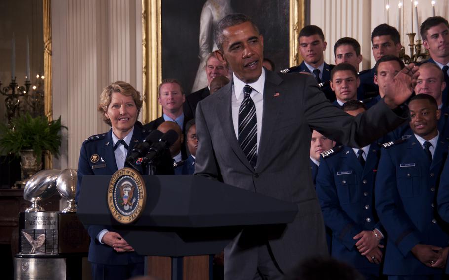 President Barack Obama presents the Commander-in-Chief's TrophyCommander-in-Chief Trophy to the U.S. Air Force Academy football team at the White House on May 7, 2015. At left is Lt. Gen. Michelle D. Johnson, the superintendent of the academy.